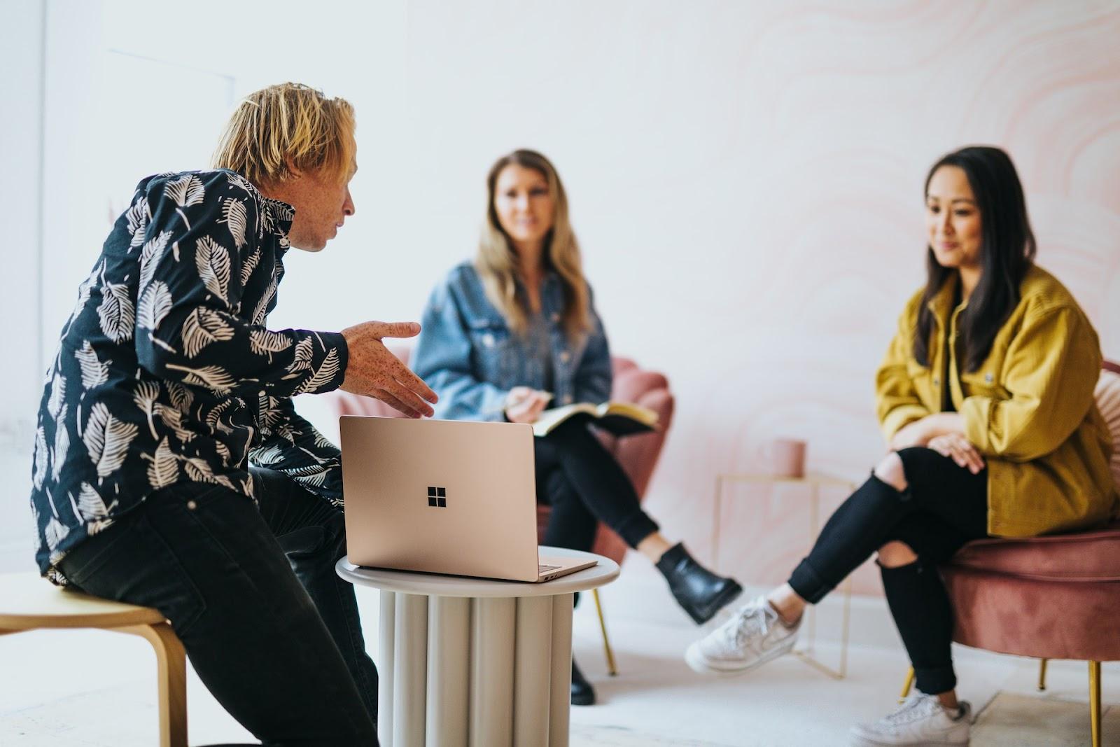 people collaborating on laptop